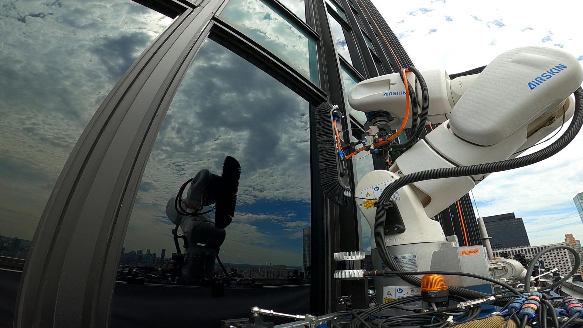 Window-washing robots are working on Manhattan skyscrapers